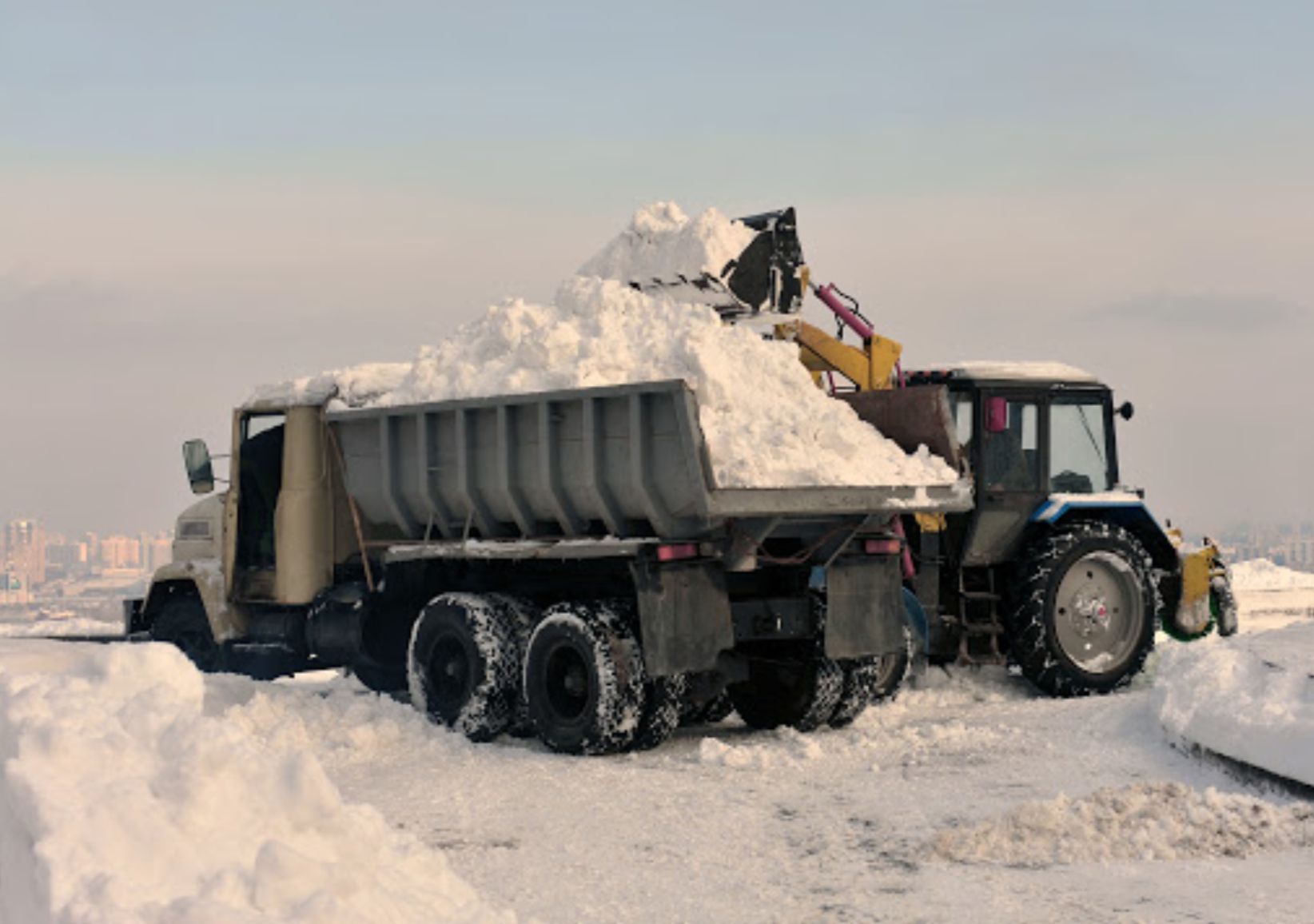 Snow removal and truck with snow